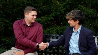 Zayne Bratschi and Liam Richichi shake hands