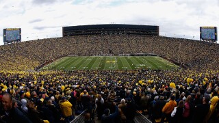 No Michigan football? President says not without students